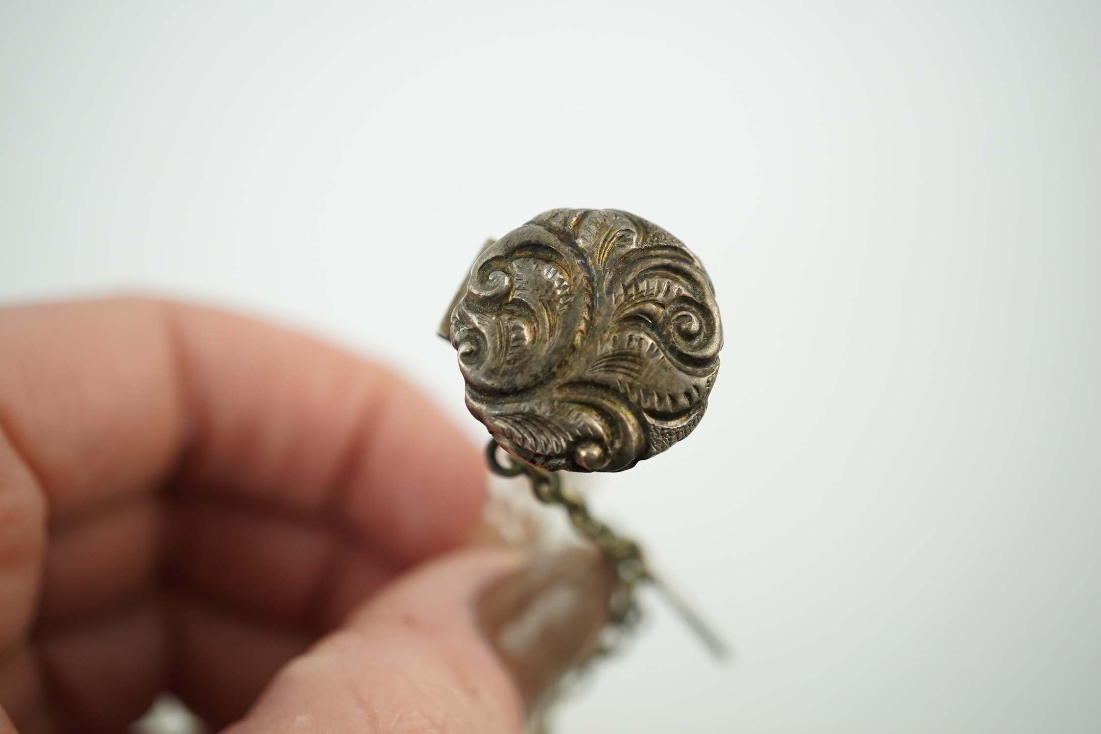 A late Victorian white metal mounted cut glass cornucopia shaped scent bottle, lacking stopper?, 54mm. Condition - poor to fair